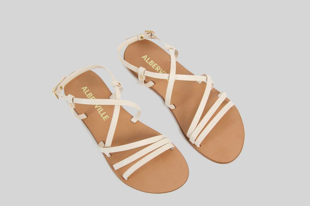 Beige sandal with thin straps.