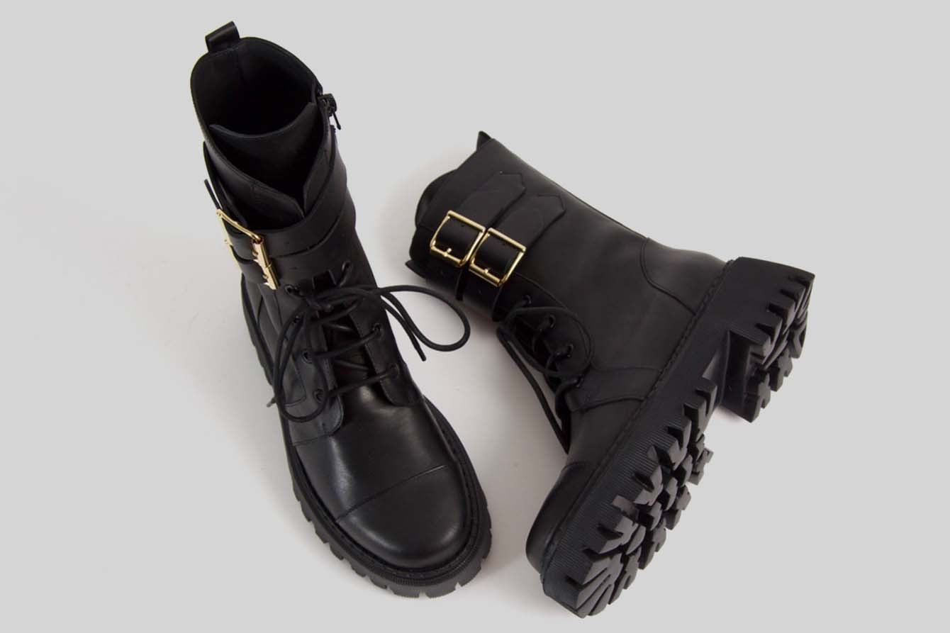 Lace-Up boots with golden buckles.