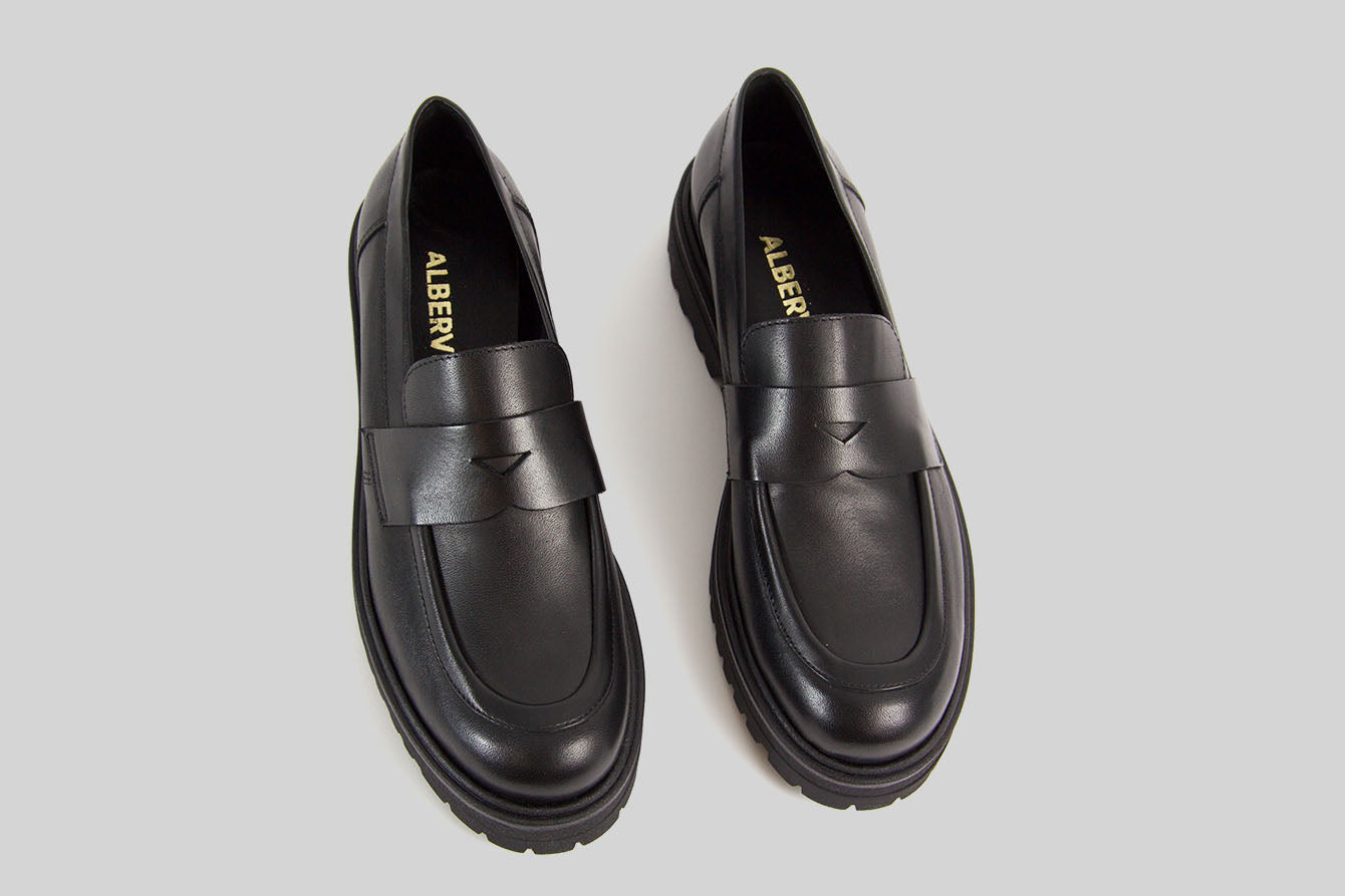 Black loafer with a chunky sole.