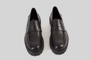 Black loafer with a chunky sole.